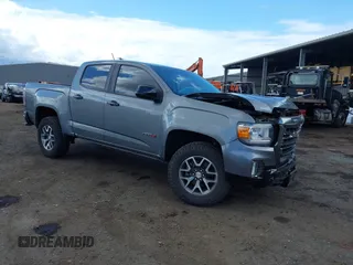 2021 GMC Canyon 4WD AT4 z VIN 1GTG6FEN8M1275345, wystawiony jako IAAI lot #42045878 z przebiegiem 68 299 mil mil oraz . Historia ofert i sprzedaży dostępna na DreamBid. Obrazek 1.