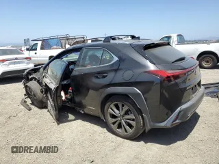 2019 Lexus UX 250h with VIN JTHU9JBH2K2013001, listed as a Copart auction lot 59142205 with 104,917 mi miles and Salvage title. Bid and sale history available at DreamBid. Image 2.