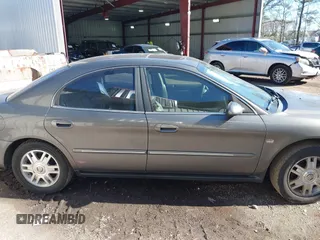 2004 Mercury Sable LS Premium z VIN 1MEHM55S54G607845, wystawiony jako IAAI lot #41812758 z przebiegiem 200 883 mil mil oraz . Historia ofert i sprzedaży dostępna na DreamBid. Obrazek 13.