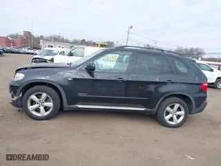 2009 BMW X5 30i with VIN 5UXFE43579L037535, listed as a IAAI auction lot 41715317 with 210,697 mi miles. Bid and sale history available at carsss.com. Image 14.