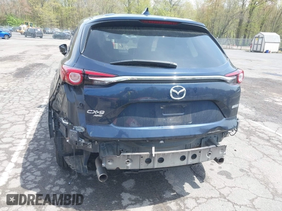 2019 Mazda CX-9 Touring z VIN JM3TCBCY6K0331905, wystawiony jako IAAI lot #42157842 z przebiegiem 84 211 mil mil oraz . Historia ofert i sprzedaży dostępna na DreamBid. Obrazek 6.