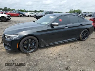 2018 BMW 5 Series M550i xDrive with VIN WBAJB9C51JB286700, listed as a Copart auction lot 64681004 with 76,304 mi miles and Salvage Title. Bid and sale history available at carsss.com. Image 1.