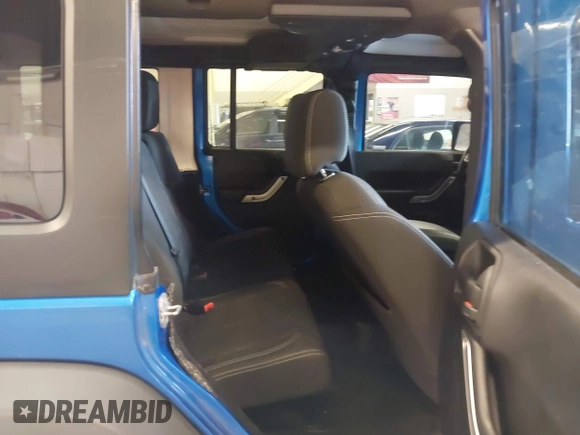 2015 Jeep Wrangler Unlimited Rubicon with VIN 1C4BJWFG7FL661643, listed as a IAAI auction lot 41291385 with 112,785 mi miles. Bid and sale history available at carsss.com. Image 8.