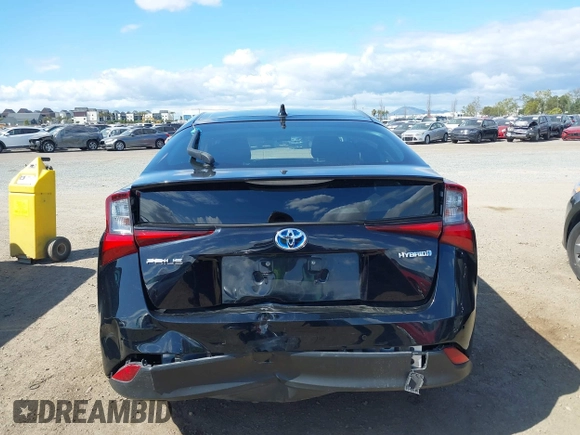 2021 Toyota Prius L Eco with VIN JTDKAMFU6M3135799, listed as a IAAI auction lot 42064241 with 77,120 mi miles and . Bid and sale history available at DreamBid. Image 16.