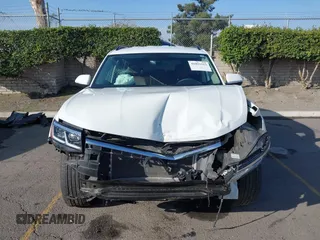 2023 Volkswagen Atlas SE z VIN 1V2WP2CA6PC533984, wystawiony jako IAAI lot #41021512 z przebiegiem 26 993 mil mil oraz . Historia ofert i sprzedaży dostępna na DreamBid. Obrazek 12.
