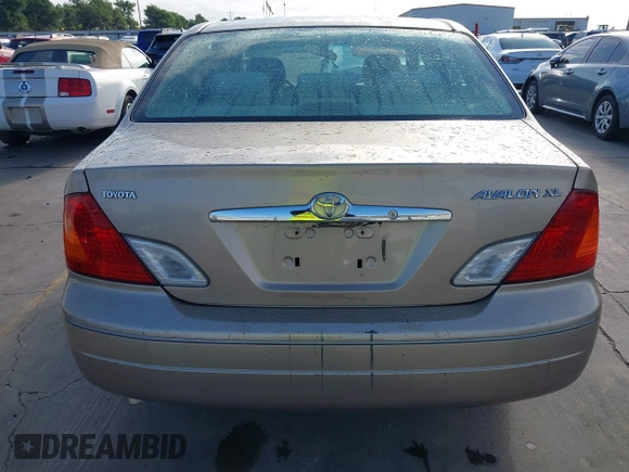 2001 Toyota Avalon XL z VIN 4T1BF28B31U185174, wystawiony jako IAAI lot #42338204 z przebiegiem 298 540 mil mil oraz . Historia ofert i sprzedaży dostępna na DreamBid. Obrazek 16.