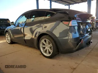 2021 Tesla Model Y Long Range with VIN 5YJYGDEEXMF151557, listed as a Copart auction lot 54936885 with 106,411 mi miles and Salvage Title. Bid and sale history available at DreamBid. Image 2.
