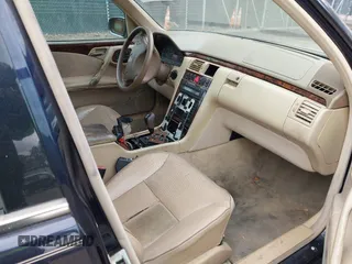 2002 Mercedes-Benz E-Class AWD with VIN WDBJF83J32X068355, listed as a IAAI auction lot 41872613 with 143,501 mi miles. Bid and sale history available at carsss.com. Image 5.