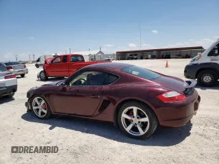 2006 Porsche Cayman S с VIN WP0AB29806U785415, выставлен на аукционе Copart как лот 52888794 с пробегом 106 896 миль миль и Списание • Salvage title. История ставок и продаж доступна на DreamBid. Изображение 2.