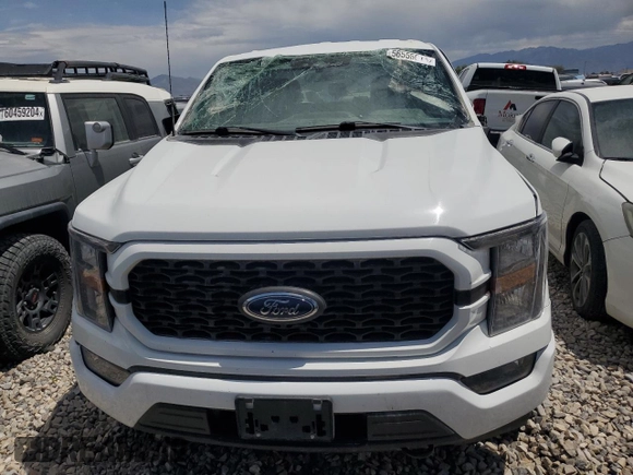 2023 Ford F-150 XL with VIN 1FTEW1EPXPFC20804, listed as a Copart auction lot 56555615 with 60,984 mi miles and Salvage title. Bid and sale history available at DreamBid. Image 5.