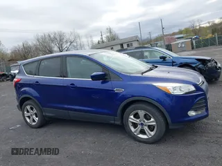 2015 Ford Escape SE with VIN 1FMCU9GX4FUC73125, listed as a IAAI auction lot 42071815 with 71,681 mi miles. Bid and sale history available at carsss.com. Image 13.