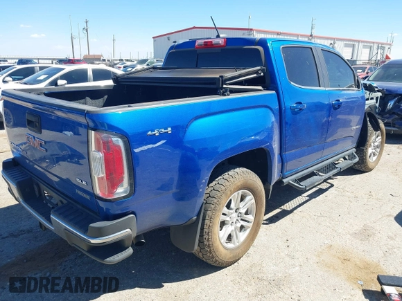 2019 GMC Canyon 4WD SLE z VIN 1GTG6CENXK1222416, wystawiony jako IAAI lot #41878077 z przebiegiem 85 415 mil mil oraz . Historia ofert i sprzedaży dostępna na DreamBid. Obrazek 4.