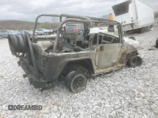 2004 Jeep Wrangler Rubicon with VIN 1J4FA69S74P787812, listed as a Copart auction lot 49821695 with Not provided miles and Salvage title. Bid and sale history available at DreamBid. Image 3.