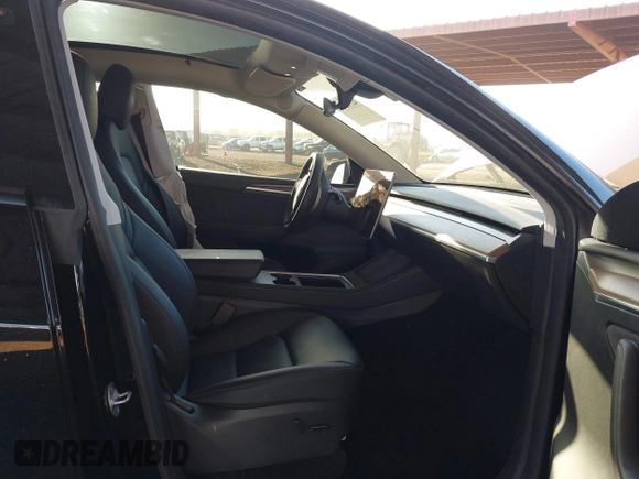 2023 Tesla Model Y Long Range with VIN 7SAYGDEE8PF815622, listed as a IAAI auction lot 41515433 with 70,862 mi miles and . Bid and sale history available at DreamBid. Image 5.