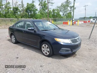 2010 Kia Optima LX z VIN KNAGG4A89A5400338, wystawiony jako IAAI lot #42410076 z przebiegiem 253 870 mil mil oraz . Historia ofert i sprzedaży dostępna na DreamBid. Obrazek 1.