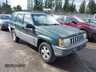 1995 Jeep Grand Cherokee Laredo with VIN 1J4GZ58SXSC676393, listed as a IAAI auction lot 41943464 with 244,317 mi miles. Bid and sale history available at carsss.com. Image 1.