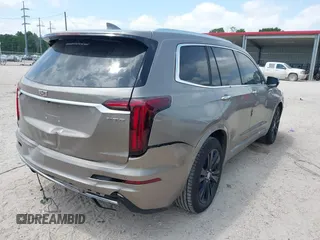 2022 Cadillac XT6 Premium Luxury z VIN 1GYKPCRS4NZ107852, wystawiony jako IAAI lot #42075012 z przebiegiem 66 046 mil mil oraz . Historia ofert i sprzedaży dostępna na DreamBid. Obrazek 4.