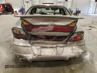 2002 Pontiac Bonneville SLE z VIN 1G2HY54K124211759, wystawiony jako Copart lot #54573555 z przebiegiem 106 409 mil mil oraz Szkoda całkowita • Salvage title. Historia ofert i sprzedaży dostępna na DreamBid. Obrazek 6.