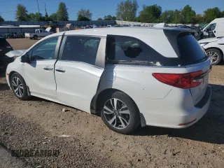 2021 Honda Odyssey Touring with VIN 5FNRL6H86MB003309, listed as a Copart auction lot 51648654 with 132,393 mi miles and Salvage Title. Bid and sale history available at carsss.com. Image 2.