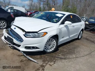 2015 Ford Fusion Energi SE Luxury with VIN 3FA6P0PU0FR272349, listed as a IAAI auction lot 41844130 with 140,353 mi miles. Bid and sale history available at carsss.com. Image 2.