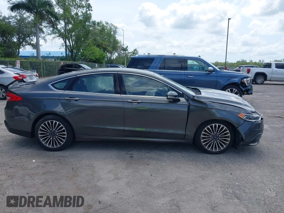 2018 Ford Fusion Titanium with VIN 3FA6P0D9XJR169657, listed as a IAAI auction lot 42392112 with 62,754 mi miles and . Bid and sale history available at DreamBid. Image 14.