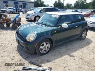 2010 MINI Hardtop with VIN WMWMF3C5XATU77721, listed as a Copart auction lot 62646495 with 111,741 mi miles and Salvage title. Bid and sale history available at DreamBid. Image 1.