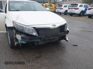 2015 Kia Optima LX with VIN KNAGM4A70F5571034, listed as a IAAI auction lot 41734211 with 214,948 mi miles. Bid and sale history available at carsss.com. Image 6.
