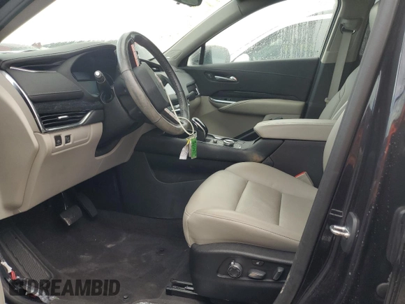 2022 Cadillac XT4 FWD Premium Luxury z VIN 1GYFZCR44NF166169, wystawiony jako Copart lot #77981414 z przebiegiem 9 734 mil mil oraz Nie do naprawy • Non repairable. Historia ofert i sprzedaży dostępna na DreamBid. Obrazek 7.