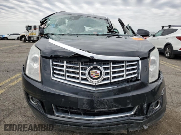 2014 Cadillac SRX Premium Collection z VIN 3GYFNGE31ES688270, wystawiony jako Copart lot #52795245 z przebiegiem 134 103 mil mil oraz Szkoda całkowita • Salvage title. Historia ofert i sprzedaży dostępna na DreamBid. Obrazek 5.