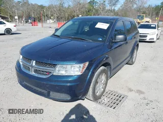 2014 Dodge Journey SE with VIN 3C4PDCABXET277723, listed as a IAAI auction lot 41709752 with 161,587 mi miles and . Bid and sale history available at DreamBid. Image 2.