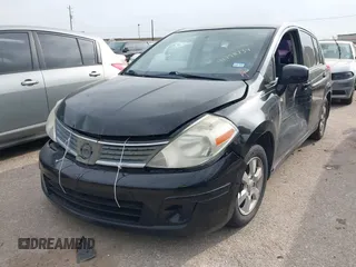 2009 Nissan Versa 1.8 SL with VIN 3N1BC13E59L496882, listed as a IAAI auction lot 41798734 with 210,907 mi miles. Bid and sale history available at carsss.com. Image 2.
