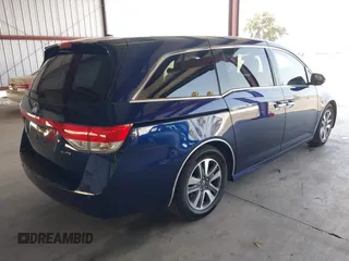 2017 Honda Odyssey Touring with VIN 5FNRL5H90HB017215, listed as a IAAI auction lot 42574528 with 61,386 mi miles and . Bid and sale history available at DreamBid. Image 4.