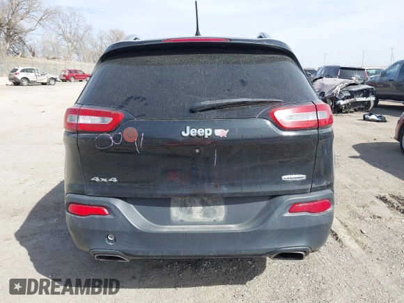 2015 Jeep Cherokee North with VIN 1C4PJMCS7FW544792, listed as a IAAI auction lot 41801573 with 140,575 mi miles. Bid and sale history available at carsss.com. Image 16.