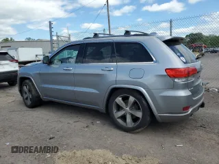 2015 Jeep Grand Cherokee Overland with VIN 1C4RJFCG3FC880084, listed as a Copart auction lot 57291165 with 112,442 mi miles and Salvage title. Bid and sale history available at DreamBid. Image 2.
