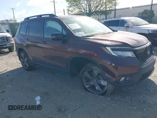 2021 Honda Passport Touring z VIN 5FNYF8H91MB022986, wystawiony jako IAAI lot #42077321 z przebiegiem 20 497 mil mil oraz . Historia ofert i sprzedaży dostępna na DreamBid. Obrazek 1.