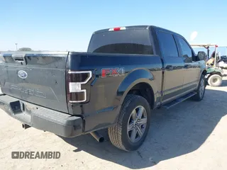 2018 Ford F-150 XL with VIN 1FTEW1E50JKE13640, listed as a IAAI auction lot 41228537 with 146,927 mi miles. Bid and sale history available at carsss.com. Image 4.
