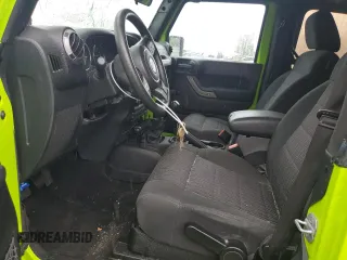 2012 Jeep Wrangler Sport with VIN 1C4AJWAG2CL233722, listed as a Copart auction lot 61125095 with 49,864 mi miles and Salvage title. Bid and sale history available at DreamBid. Image 7.