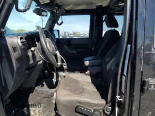 2014 Jeep Wrangler Unlimited Sport with VIN 1C4BJWDGXEL269693, listed as a Copart auction lot 46927895 with 105,691 mi miles and Salvage Title. Bid and sale history available at carsss.com. Image 7.