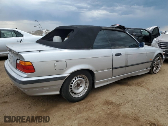 1998 BMW 3 Series 323i with VIN WBABJ8332WEM22760, listed as a Copart auction lot 59631805 with 77,300 mi miles and Salvage title. Bid and sale history available at DreamBid. Image 3.