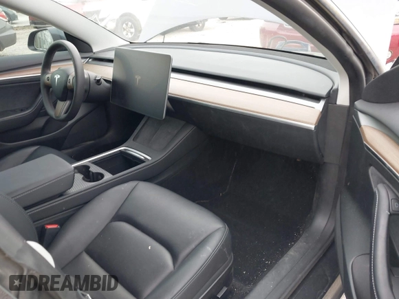 2023 Tesla Model 3 with VIN 5YJ3E1EA5PF474382, listed as a IAAI auction lot 41764268 with 31,040 mi miles and . Bid and sale history available at DreamBid. Image 5.