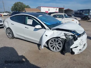 2023 Tesla Model 3 Long Range z VIN 5YJ3E1EB0PF392696, wystawiony jako IAAI lot #42073535 z przebiegiem 25 208 mil mil oraz . Historia ofert i sprzedaży dostępna na DreamBid. Obrazek 1.