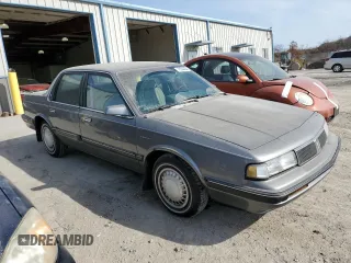 1990 Oldsmobile Cutlass z VIN 2G3AL54R2L2339637, wystawiony jako Copart lot #78364484 z przebiegiem 89 106 mil mil oraz Tytuł czysty. Historia ofert i sprzedaży dostępna na DreamBid. Obrazek 4.