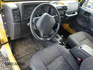 2001 Jeep Wrangler Sport z VIN 1J4FA49S01P355451, wystawiony jako Copart lot #56501545 z przebiegiem 213 027 mil mil oraz Czysty tytuł • Clean title. Historia ofert i sprzedaży dostępna na DreamBid. Obrazek 8.