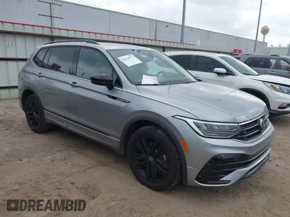 2022 Volkswagen Tiguan SE R-Line Black with VIN 3VVCB7AXXNM165748, listed as a IAAI auction lot 42178772 with 64,007 mi miles and . Bid and sale history available at DreamBid. Image 1.