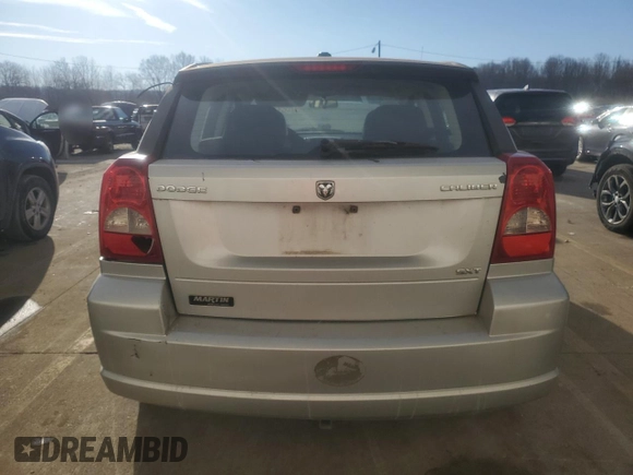 2009 Dodge Caliber SXT z VIN 1B3HB48A59D104136, wystawiony jako Copart lot #45971285 z przebiegiem 291 374 mil mil oraz Szkoda całkowita • Salvage title. Historia ofert i sprzedaży dostępna na DreamBid. Obrazek 6.