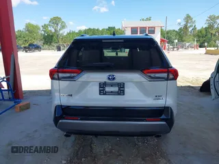 2021 Toyota RAV4 Hybrid XSE with VIN 2T3E6RFV9MW019837, listed as a IAAI auction lot 42002574 with 74,214 mi miles. Bid and sale history available at carsss.com. Image 17.