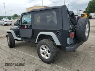 2005 Jeep Wrangler Unlimited with VIN 1J4FA44S75P358246, listed as a Copart auction lot 60958695 with 150,003 mi miles and Salvage title. Bid and sale history available at DreamBid. Image 2.
