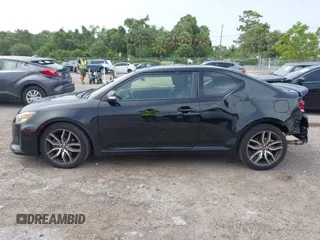2014 Scion tC z VIN JTKJF5C76E3078256, wystawiony jako IAAI lot #42437930 z przebiegiem 239 399 mil mil oraz . Historia ofert i sprzedaży dostępna na DreamBid. Obrazek 14.