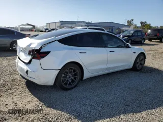 2021 Tesla Model 3 Standard Range Plus with VIN 5YJ3E1EA0MF072457, listed as a Copart auction lot 51666135 with 32,534 mi miles and Salvage Title. Bid and sale history available at carsss.com. Image 3.