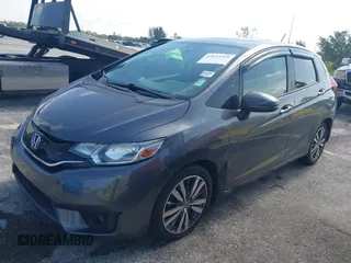 2015 Honda Fit EX-L z VIN 3HGGK5H89FM730013, wystawiony jako IAAI lot #42673309 z przebiegiem 142 660 mil mil oraz . Historia ofert i sprzedaży dostępna na DreamBid. Obrazek 6.